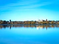 Bemidji, Minnesota reflection is seen across Lake Irving on sunny day