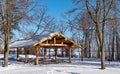 BEMIDJI, MN - 5 JAN 2020: Log picnic shelter on sunny winter day Royalty Free Stock Photo