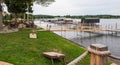 Bemus Point, New York, USA September 12, 2023 A pier with docked boats on Chautauqua Lake with a sitting area Royalty Free Stock Photo