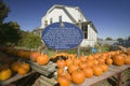 Ben Franklin proverb on sign next to pumpkin stand at Halloween in Lexington Massachusetts, New England