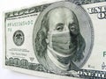 Ben Franklin wears a protect Healthcare Mask on a One Hundred Dollar Bill Illustrates the many costs of the Coronavirus outbreak Royalty Free Stock Photo