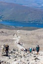 BEN NEVIS, SCOTLAND - SEPTEMBER 01 2021: Hikers making their way up the main track towards the summit of Ben Nevis on a hot, clear Royalty Free Stock Photo