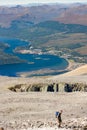 BEN NEVIS, SCOTLAND - SEPTEMBER 01 2021: Hikers making their way up the main track towards the summit of Ben Nevis on a hot, clear Royalty Free Stock Photo