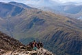 BEN NEVIS, SCOTLAND - SEPTEMBER 01 2021: Hikers making their way up the main track towards the summit of Ben Nevis on a hot, clear