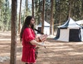 The bard - participant of the reconstruction `Viking Village` plays the lute in the camp in the forest near Ben Shemen in Israel