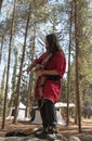 The bard - participant of the reconstruction `Viking Village` plays the lute in the camp in the forest near Ben Shemen in Israel