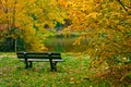 Bench along lake in autumn