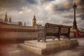 Bench along River Thames with a view of Big Ben Royalty Free Stock Photo