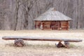 Bench before an antique hut with a straw roof Royalty Free Stock Photo