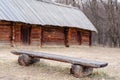 Bench before an antique hut with a straw roof Royalty Free Stock Photo