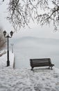 Bench on the banks of frozen lake Orestiada in Kastoria