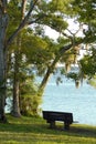 Bench by the bay at sunrise; a great  time to reflect Royalty Free Stock Photo