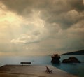 Bench on a beach in Thasos, Greece. Sea and sunset photography
