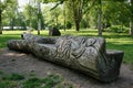 Bench carved from a tree trunk in Bute Park in Cardiff Royalty Free Stock Photo