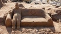 Bench carving on sand, with sandy-man sitting on Royalty Free Stock Photo