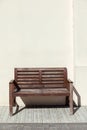 Street wooden bench near old wall Royalty Free Stock Photo