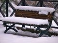 Bench covered in snow. Litohoro in Pieria, Greece at winter time Royalty Free Stock Photo