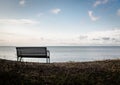 Bench on a Curonian Lagoon shore Royalty Free Stock Photo