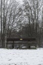 Bench empty seat in wood trees winter and fog 4