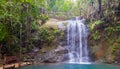 Bench and waterfall in Colo-i-Suva rain forest national park, nature reserve near Suva, Viti Levu island, Fiji, Melanesia, Oceania Royalty Free Stock Photo