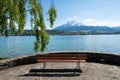 Bench faces to Geneva lake and alps landscape view Royalty Free Stock Photo