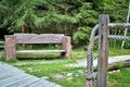 Bench in the forest open-air museum in Vydrovo. Royalty Free Stock Photo