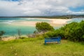 Bench in front of Merimbula bay in New South Wales Royalty Free Stock Photo