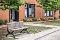 Bench in front of a modern brick building Royalty Free Stock Photo