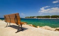 Bench in front of rock beach