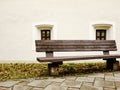 Bench in front of two old Windows