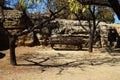 A bench in front of which shadows from the trees. The Valle dei Templi, Agrigento, Sicily, Italy Royalty Free Stock Photo