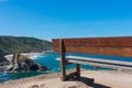 Bench high on the cliff by the ocean