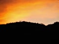 Bench on a Hill with Orange Glowing Sky