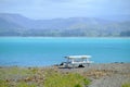 Bench beside lake Pukaki with mount cook