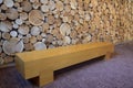 Bench with logs wall