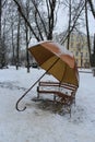 The bench is made in the form of an umbrella.