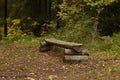 Bench made of logs in the forest