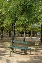 Bench and metal chairs in the park. Deserted park Royalty Free Stock Photo