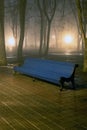 Bench In Misty City Park At Night