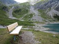 Bench lakeside in high alpine landscape