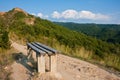 Bench on a Mountain Path Royalty Free Stock Photo