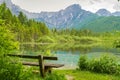 Bench near Alps mountains and lake in Almsee in Austria