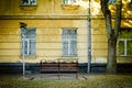 Bench near old yellow house facade Royalty Free Stock Photo