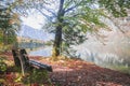 Bench near picturesque lake Bohinj in the Triglav National Park in Slovenia. Autumn landscape Royalty Free Stock Photo