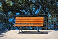 Bench near the water in the park on a sunny day Royalty Free Stock Photo