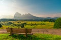 Bench with nobody in Italian Dolomiti Alps during sunrise. Seiser Alm or Alpe di Siusi location, South Tyrol, Italy