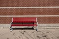 Bench on old town alley over wall background Royalty Free Stock Photo