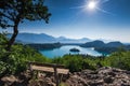 Bench overlooking Bled lake panoramic vista in full summer sun