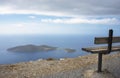 Bench overlooking the Islet of Samiopoula. Royalty Free Stock Photo