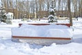 Bench in the park, covered with snow. Russia. Siberia. Winter Royalty Free Stock Photo